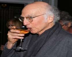 Larry David consuming alcohol